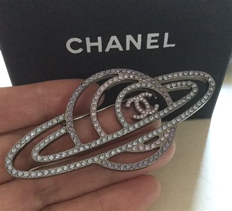 chanel saturn brooch|designer chanel brooches.